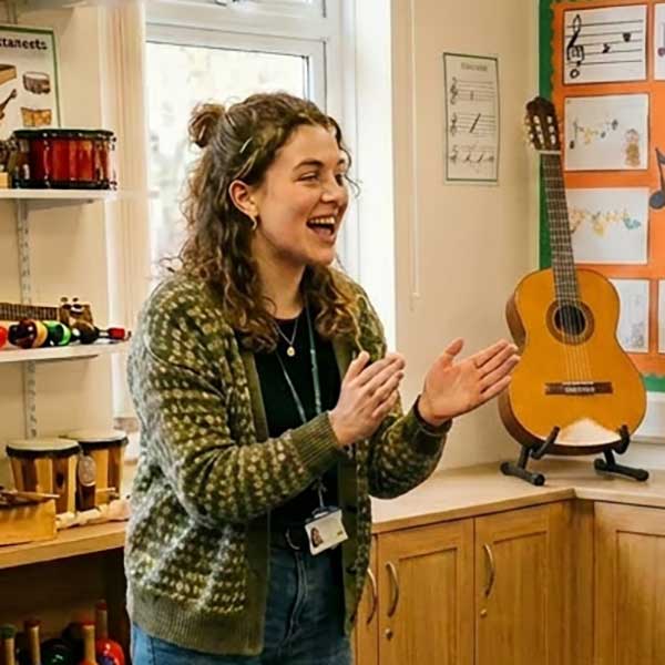 Teacher Teaching Music With No Smartboard